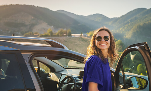 lady-standing-next-to-car
